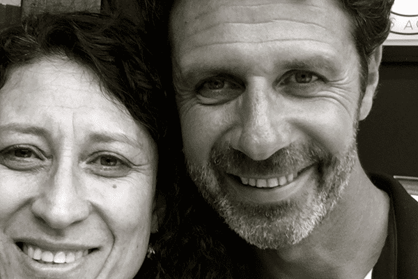A man and woman smiling for the camera.