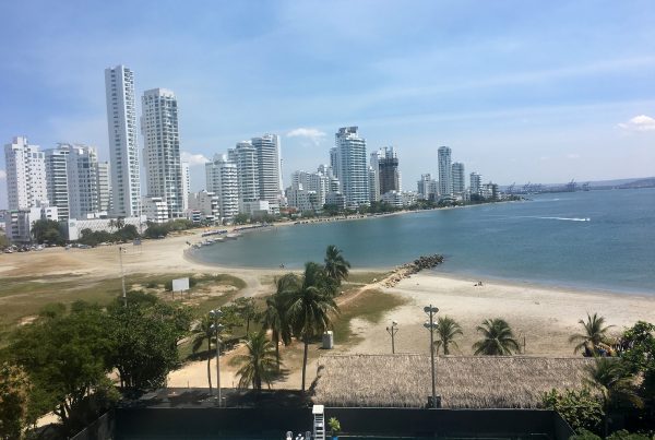 A view of the beach and skyline from an apartment.