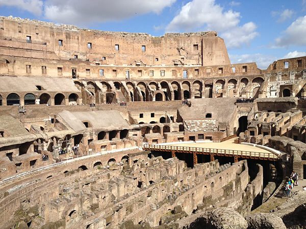 A view of the inside of an old roman colosseum.