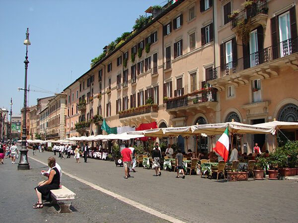 A street with many tables and chairs on it